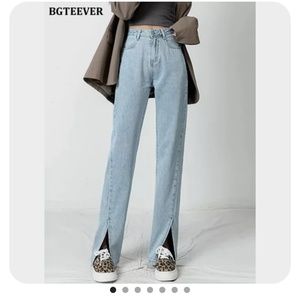 Blue denim jeans with front slits